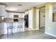An updated kitchen that features granite counter tops, stainless steel appliances and modern flooring at 7316 Hunters Greene Cir, Lakeland, FL 33810