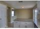 This kitchen includes granite countertops, white cabinets, stainless steel appliances, and backyard access at 7316 Hunters Greene Cir, Lakeland, FL 33810