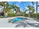 Hot tub surrounded by lush greenery, offering a tranquil and private space at 7526 Pellham Way, Kissimmee, FL 34747
