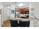 Well-equipped kitchen featuring stainless steel appliances, a breakfast bar, and ample countertop space at 7526 Pellham Way, Kissimmee, FL 34747