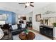 Spacious living room with modern decor, a kitchen view, and a comfortable seating area for entertaining at 7526 Pellham Way, Kissimmee, FL 34747
