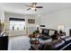 Inviting living room with a ceiling fan, an area rug, and a comfortable sofa, perfect for relaxation at 7526 Pellham Way, Kissimmee, FL 34747