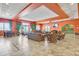 A stylish lounge area is furnished with comfortable seating and adorned with elegant decor at 7526 Pellham Way, Kissimmee, FL 34747