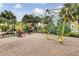 A playground is equipped with colorful slides, climbing structures, and ample play space at 7526 Pellham Way, Kissimmee, FL 34747