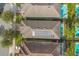 An aerial view showcases the rooftop solar panels on this home at 7615 Brookhurst Ln, Kissimmee, FL 34747