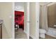 Bathroom with a shower/tub combo and doorway view of the game room at 7615 Brookhurst Ln, Kissimmee, FL 34747