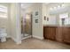 Bathroom features a shower, vanity with cabinets, and tile flooring at 7615 Brookhurst Ln, Kissimmee, FL 34747
