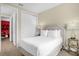 Cozy bedroom with a comfortable bed and view into the game room at 7615 Brookhurst Ln, Kissimmee, FL 34747