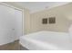 Simple bedroom with a large closet offers storage and a clean and neutral design at 7615 Brookhurst Ln, Kissimmee, FL 34747