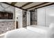 Harry Potter themed bedroom has two twin beds with stone accents, exposed beams, TV, and ensuite at 7615 Brookhurst Ln, Kissimmee, FL 34747