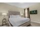 Comfortable bedroom with large bed and lamps, offers a cozy and inviting atmosphere at 7615 Brookhurst Ln, Kissimmee, FL 34747