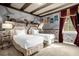 The Harry Potter themed bedroom has two twin beds, stone accent walls, wooden beams and decorative curtains at 7615 Brookhurst Ln, Kissimmee, FL 34747