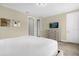 Bright bedroom with neutral walls features a dresser and carpet flooring at 7615 Brookhurst Ln, Kissimmee, FL 34747