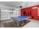 Spacious garage features an overhead door and ping pong table at 7615 Brookhurst Ln, Kissimmee, FL 34747