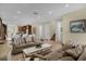 Expansive living room with open floor plan, seamlessly connects to the dining and kitchen areas at 7615 Brookhurst Ln, Kissimmee, FL 34747