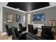 Home theater room features tiered seating with black leather recliners, a projector screen, and a popcorn machine at 7615 Brookhurst Ln, Kissimmee, FL 34747