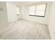 Bright bedroom features clean white walls, new flooring and natural light at 817 Clay Blvd, Eustis, FL 32726
