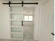 Bright bedroom features modern sliding door, stylish hardware, and light, neutral flooring at 817 Clay Blvd, Eustis, FL 32726