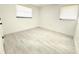 A simple, unfurnished bedroom with two windows at 817 Clay Blvd, Eustis, FL 32726