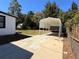 View of the carport attached to this home showing ample parking, with green foliage visible to the right at 817 Clay Blvd, Eustis, FL 32726