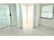 Open closet with white bi-fold doors, white interior and bright lighting at 817 Clay Blvd, Eustis, FL 32726