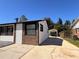 The house features a long driveway that leads to a carport, providing convenient covered parking at 817 Clay Blvd, Eustis, FL 32726