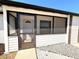 Charming screened-in front porch perfect for relaxing, with stone accents and a welcoming entrance at 817 Clay Blvd, Eustis, FL 32726