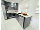 Modern kitchen showcasing black cabinets, stainless steel appliances, quartz countertops, and a contemporary faucet adding style at 817 Clay Blvd, Eustis, FL 32726