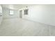 Large room with light wood-look floors and natural light at 817 Clay Blvd, Eustis, FL 32726