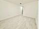 Bright empty room with neutral flooring, clean white walls and recessed lighting at 817 Clay Blvd, Eustis, FL 32726