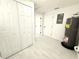 Hallway features a utility room and closet storage at 817 Clay Blvd, Eustis, FL 32726