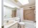 Cozy bathroom with shower-tub combo and vanity, perfect for a relaxing experience at 845 Orchid Springs Dr, Winter Haven, FL 33884