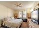 Bright bedroom with a ceiling fan, twin side cabinets, and a well-lit window at 845 Orchid Springs Dr, Winter Haven, FL 33884