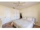 Inviting bedroom boasts a ceiling fan, two closets, and comfortable furnishings for a peaceful retreat at 845 Orchid Springs Dr, Winter Haven, FL 33884