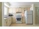 Well-lit kitchen with functional appliances, generous cabinet space, and a practical design at 845 Orchid Springs Dr, Winter Haven, FL 33884