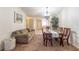 Comfortable living and dining area with sofa, decorative table, and view to the kitchen at 845 Orchid Springs Dr, Winter Haven, FL 33884