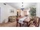 Cozy living and dining area with comfortable sofa, decorative table, and lovely furnishings at 845 Orchid Springs Dr, Winter Haven, FL 33884