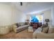 Inviting living space with neutral tones, comfortable sofas, and a modern TV for a cozy home atmosphere at 845 Orchid Springs Dr, Winter Haven, FL 33884