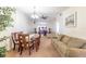 Inviting dining and living space with ample seating, perfect for relaxing or entertaining guests at 845 Orchid Springs Dr, Winter Haven, FL 33884