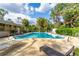 Refreshing community pool lined with lounge chairs offering an oasis in the sunshine at 845 Orchid Springs Dr, Winter Haven, FL 33884