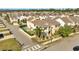 Aerial view of home featuring a private pool and play area in a desirable neighborhood at 8498 Powder Ridge Trl, Windermere, FL 34786
