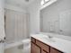 Bathroom with tub and a large mirror over a single sink vanity at 8498 Powder Ridge Trl, Windermere, FL 34786