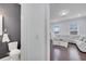 Elegant half bathroom featuring modern fixtures and dark gray accent wall at 8498 Powder Ridge Trl, Windermere, FL 34786