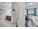 Bright, open bedroom with hardwood flooring, ensuite bath, and a large window at 8498 Powder Ridge Trl, Windermere, FL 34786