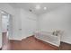 This bedroom features wood floors and a decorative light at 8498 Powder Ridge Trl, Windermere, FL 34786