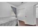 Cozy bedroom with wood floors, window and gray paisley comforter at 8498 Powder Ridge Trl, Windermere, FL 34786