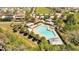 Community pool and amenities, including a splash pad and a shaded seating area at 8498 Powder Ridge Trl, Windermere, FL 34786