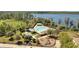 A gorgeous community pool offers lounge chairs and a playground near a lake at 8498 Powder Ridge Trl, Windermere, FL 34786