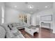 Comfortable living room with a large gray sectional sofa and a modern coffee table at 8498 Powder Ridge Trl, Windermere, FL 34786