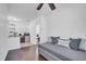 Inviting living area with wood floors, comfortable daybed, and partial view of the kitchenette area at 8498 Powder Ridge Trl, Windermere, FL 34786